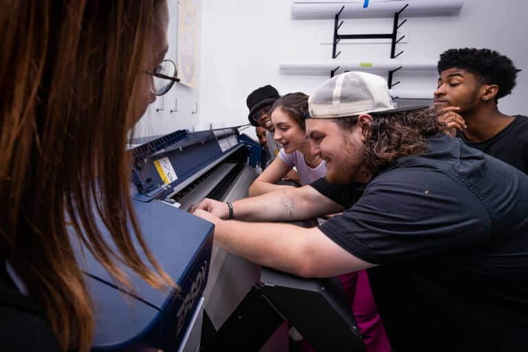 graphic design students in print shop